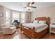 Comfortable bedroom with a ceiling fan and a large window bay for natural light at 75 E Moss Creek Dr, Clayton, NC 27520