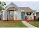 Charming single-story home featuring a covered front porch, bay window, and well-manicured lawn at 75 E Moss Creek Dr, Clayton, NC 27520