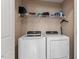 Well-organized laundry room with washer, dryer, and plenty of storage at 75 E Moss Creek Dr, Clayton, NC 27520