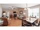 Open-concept living room with hardwood floors, fireplace, and a dining area, perfect for entertaining guests at 75 E Moss Creek Dr, Clayton, NC 27520