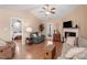 Spacious living room featuring hardwood floors, a fireplace, and an open layout at 75 E Moss Creek Dr, Clayton, NC 27520