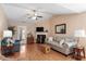 Comfortable living room with hardwood floors, a cozy fireplace, and ample natural light at 75 E Moss Creek Dr, Clayton, NC 27520