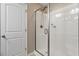 An enclosed glass shower with a door is located next to the door at 75 E Moss Creek Dr, Clayton, NC 27520