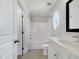 A bathroom featuring a white vanity and shower-tub combo at 7818 Spungold St, Raleigh, NC 27617