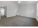 Inviting bedroom with plush carpeting and a ceiling fan, offering a comfortable and airy atmosphere at 7818 Spungold St, Raleigh, NC 27617