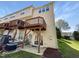Exterior rear view of a multi-story home with decks and a patio at 7818 Spungold St, Raleigh, NC 27617
