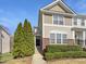 Charming townhome with brick accents, tidy landscaping, and a welcoming entrance at 7818 Spungold St, Raleigh, NC 27617