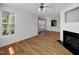 A bright living room featuring wood floors and a fireplace at 7818 Spungold St, Raleigh, NC 27617