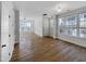 Spacious living room with lots of natural light from many windows, complemented by wood-look flooring at 7818 Spungold St, Raleigh, NC 27617