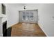 A bright living room featuring wood floors and a fireplace at 7818 Spungold St, Raleigh, NC 27617
