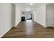 Open living room with fireplace and sliding glass doors at 7818 Spungold St, Raleigh, NC 27617
