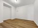 An empty room featuring LVP flooring and white walls at 7818 Spungold St, Raleigh, NC 27617