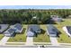 A vibrant neighborhood featuring meticulously landscaped yards, modern homes, and lush greenery at 8710 Kenridge Ln, Fuquay Varina, NC 27526
