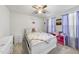 Charming bedroom with white furniture, a ceiling fan, and plush stuffed animals, great for a room at 8710 Kenridge Ln, Fuquay Varina, NC 27526