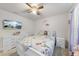 Bright bedroom with a ceiling fan and white furniture, perfect for children or guests at 8710 Kenridge Ln, Fuquay Varina, NC 27526