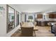 Spacious dining room with backyard views and access to modern kitchen at 8710 Kenridge Ln, Fuquay Varina, NC 27526