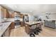 Open kitchen features granite counters, stainless appliances, and island with seating at 8710 Kenridge Ln, Fuquay Varina, NC 27526