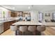 Well-lit kitchen with granite countertops, stainless appliances, and center island at 8710 Kenridge Ln, Fuquay Varina, NC 27526