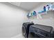 Neat laundry room with modern washer and dryer units at 8710 Kenridge Ln, Fuquay Varina, NC 27526