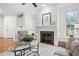 Bright living room featuring a fireplace and hardwood floors at 921 Alden Bridge Dr, Cary, NC 27519