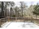 Wood deck showing the construction and overlooks the wooded backyard of the property at 9511 Collins Creek Dr, Chapel Hill, NC 27516