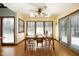 Light-filled dining room with a ceiling fan, hardwood floors and views to the outdoors at 9511 Collins Creek Dr, Chapel Hill, NC 27516