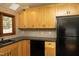 Kitchen features light wood cabinets and modern appliances with a backsplash at 9511 Collins Creek Dr, Chapel Hill, NC 27516