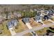 An aerial view of a neighborhood featuring well-maintained lawns and mature trees at 96 Foxtail Ct, Clayton, NC 27520