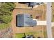 Aerial view of a home with a driveway and lawn, showing the roof and surrounding landscape at 96 Foxtail Ct, Clayton, NC 27520