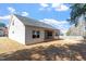 View of home showing back porch and manicured back yard. Lawn is dormant at 96 Foxtail Ct, Clayton, NC 27520
