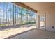Covered back patio leading to a treed yard with privacy fence at 96 Foxtail Ct, Clayton, NC 27520