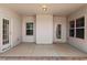 Covered back porch featuring neutral colors and ample natural light, perfect for outdoor relaxation at 96 Foxtail Ct, Clayton, NC 27520