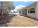 Fenced backyard with a view of the home's rear elevation and covered patio at 96 Foxtail Ct, Clayton, NC 27520