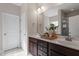 Bathroom with double vanity with stylish decor and a large mirror, complemented by a separate shower at 96 Foxtail Ct, Clayton, NC 27520