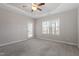 Neutral bedroom features carpet, a door to the outside, and a window offering natural light and views at 96 Foxtail Ct, Clayton, NC 27520