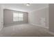 Carpeted bedroom with a window for natural light and convenient access panels at 96 Foxtail Ct, Clayton, NC 27520