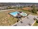 Community pool with lap lanes, lounge seating, pool house, and area, surrounded by parking at 96 Foxtail Ct, Clayton, NC 27520