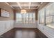 Dining room featuring coffered ceiling, large window and hardwood floors at 96 Foxtail Ct, Clayton, NC 27520