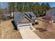 Charming home with a two-car garage, stone accents, and well-maintained lawn at 96 Foxtail Ct, Clayton, NC 27520