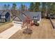 Charming home with a two-car garage, set on a grassy lot with mature trees at 96 Foxtail Ct, Clayton, NC 27520