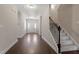 Bright foyer with hardwood flooring and staircase, offering a welcoming entry space at 96 Foxtail Ct, Clayton, NC 27520