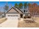 Charming single-Gathering home with a large garage, driveway, and well-maintained front yard at 96 Foxtail Ct, Clayton, NC 27520