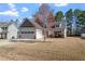 Well-maintained single-Gathering home with a two-car garage and a mature tree in the front yard at 96 Foxtail Ct, Clayton, NC 27520