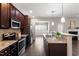 This modern kitchen has stainless steel appliances, granite counters, and breakfast bar at 96 Foxtail Ct, Clayton, NC 27520