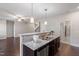 Open kitchen featuring granite counters, stainless appliances, and breakfast bar at 96 Foxtail Ct, Clayton, NC 27520