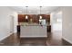 Bright kitchen boasts granite countertops, a breakfast bar and stainless steel appliances at 96 Foxtail Ct, Clayton, NC 27520