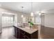 Open kitchen area with stainless appliances, granite counters and breakfast bar at 96 Foxtail Ct, Clayton, NC 27520