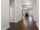 Spacious living area with hardwood floors and fireplace, seamlessly connected to other rooms at 96 Foxtail Ct, Clayton, NC 27520