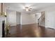 Expansive living room featuring hardwood flooring, fireplace, and staircase access at 96 Foxtail Ct, Clayton, NC 27520
