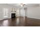 Comfortable living space with hardwood floors and a fireplace, brightened by natural light at 96 Foxtail Ct, Clayton, NC 27520